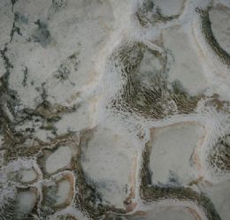 Luxury Hotel Bar Areas: Natural Stone Design with Backlit Onyx and Exploded Travertine Applications